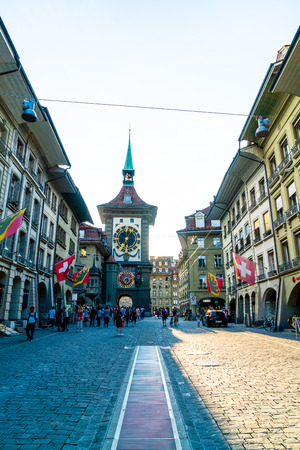 Bern, Switzerland - 23 AUG 2018: People on the shopping alley with the Zytglogge astronomical clock...