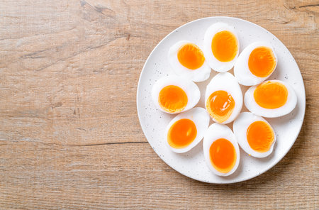 Soft Boiled Eggs on white plateの写真素材
