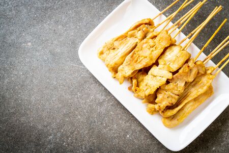 Pork satay - Grilled pork served with peanut sauce or sweet and sour sauce - Asian food styleの写真素材