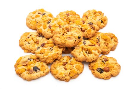 homemade cookies with cornflake raisin and almonds isolated on white backgroundの写真素材