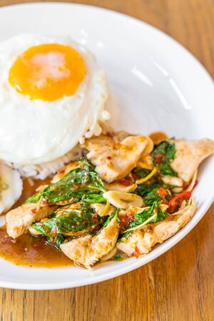 Basil Fried Chicken and fried egg with rice - Thai local food styleの写真素材