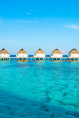 Beautiful tropical Maldives resort hotel and island with beach and sea  - boost up color processing styleのeditorial素材