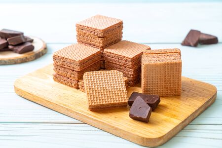 chocolate wafers with chocolate cream on wood backgroundの写真素材