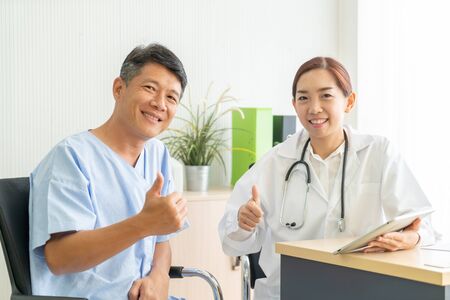 Asian Senior Patient Having Consultation With Doctor in Office  - selective focus pointの写真素材