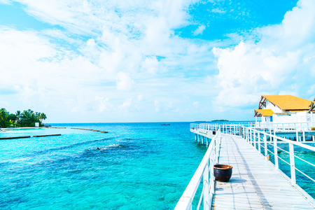 Beautiful tropical Maldives resort hotel and island with beach and sea  - boost up color processing styleのeditorial素材