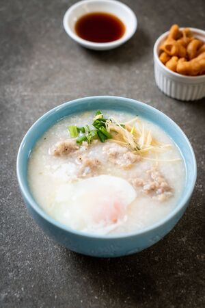 congee with minced pork in bowl - Asian breakfast styleの写真素材