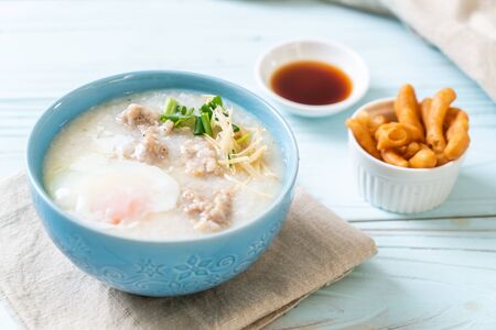 congee with minced pork in bowl - Asian breakfast styleの写真素材