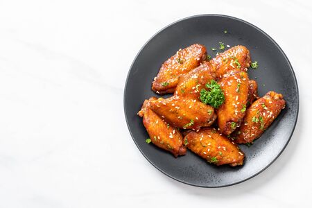 baked barbecue chicken wings with white sesameの写真素材