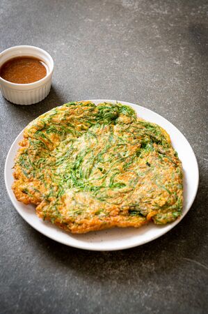 Fried Egg with Climbing Wattle and Spicy Shrimp Paste - Asian food styleの写真素材