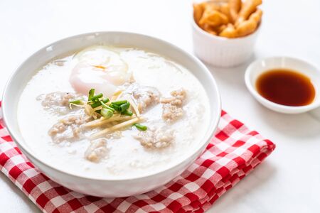 congee with minced pork in bowl - Asian breakfast style