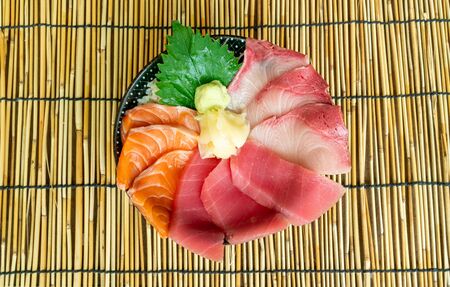 fresh salmon tuna and hamachi raw on topped rice - Donburi - Japanese food styleの写真素材