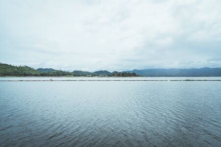 Nature scene of Srinagarind Dam with cloudy sky at kanchanaburi ,Thailandの写真素材