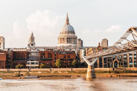 St Pauls Cathedral and the Millennium Bridge at sunset landscape in London, United Kingdom.