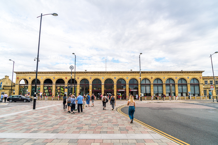 Cambridge, United Kingdom. 28 AUG 2019 : Cambridge Railway station. Passengers are seen arriving at the station and walking to the entrance.のeditorial素材