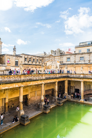 BATH, ENGLAND - AUG 30, 2019 : Roman Baths, the UNESCO World Heritage site with people, which is a site of historical interest in the city of Bath, United Kingdom.のeditorial素材