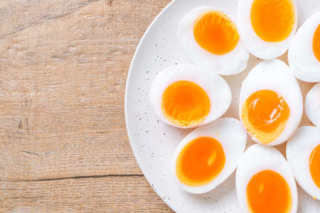 Soft Boiled Eggs on white plateの写真素材