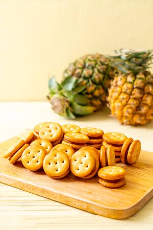 biscuits with pineapple jam on wood backgroundの写真素材