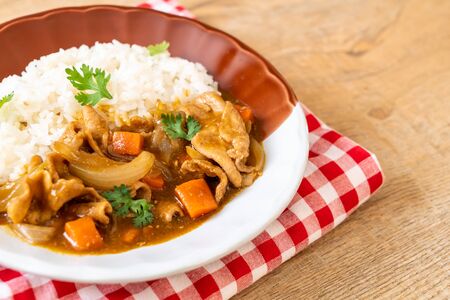 Japanese curry rice with sliced pork, carrot and onions - Asian styleの写真素材