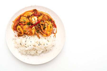 stir-fried octopus or squid and Korean spicy paste (osam bulgogi) with rice isolated on white backgroundの写真素材