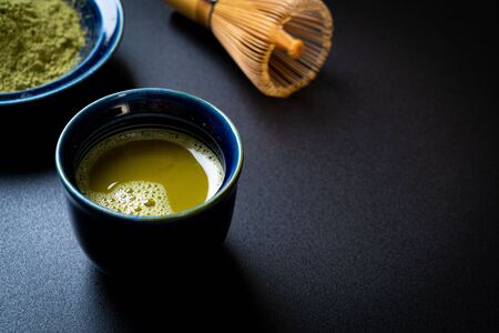 hot matcha green tea cup with green tea powder and bamboo whiskの写真素材