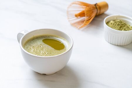 hot matcha green tea cup with green tea powder and bamboo whiskの写真素材