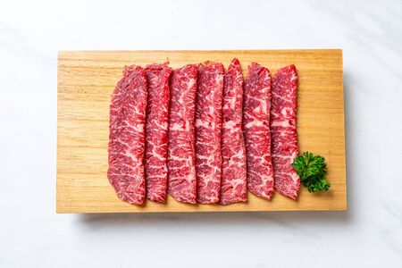 fresh beef raw sliced with marbled texture served for Sukiyaki and Shabu or Yakinikuの写真素材