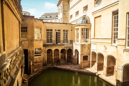 BATH, ENGLAND - AUG 30, 2019 : Roman Baths, the UNESCO World Heritage site with people, which is a site of historical interest in the city of Bath, United Kingdom.のeditorial素材