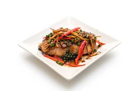 stir-fried spicy and herb with grouper fish fillet isolated on white background
