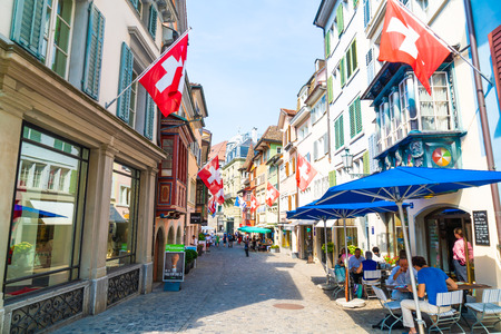 ZURICH, SWITZERLAND - AUG 23, 2018: Augustinergasse pedestrian Street with colorful buildings with...