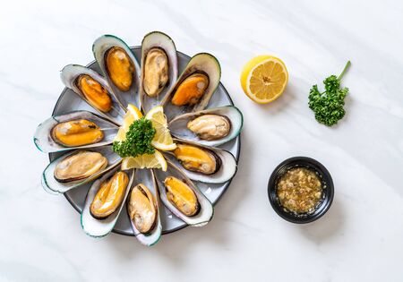 seafood mussels with lemon and parsleyの写真素材