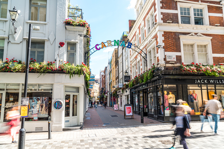 London, England, UK - SEP 2, 2019: People walking for shopping in Carnaby Street. Carnaby Street is a pedestrianised shopping street in Soho in the City of Westminster, Central London.のeditorial素材