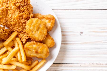 fried chicken with french fries and nuggets meal - junk food and unhealthy foodの写真素材