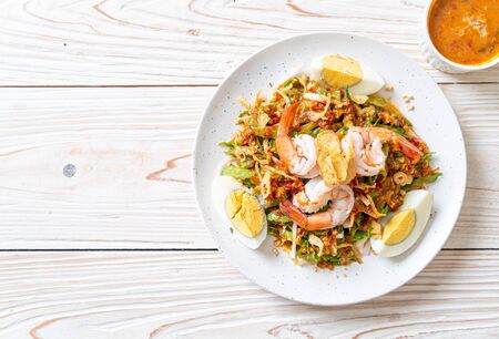 Wing Bean or Betel Nuts Spicy Salad with Prawns and Shrimps - Thai food styleの写真素材