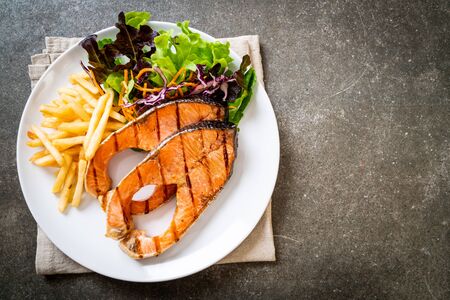 double grilled salmon steak fillet with french friesの写真素材
