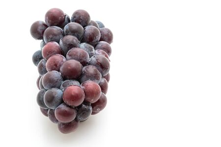 fresh black grapes isolated on white backgroundの写真素材