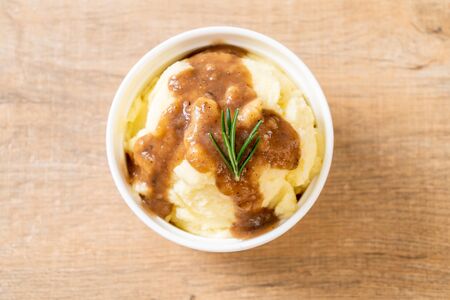 homemade mashed potatoes with gravy sauceの写真素材