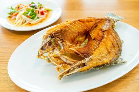 Fried snapper fish topped with fish sauce - Asian food style