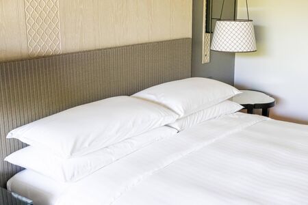 white pillows decoration on bed in bedroom