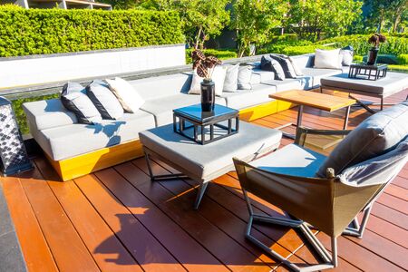 pillows with outdoor patio deck and sofa on balcony in gardenの写真素材