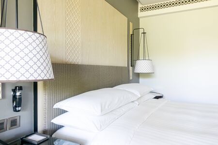 white pillows decoration on bed in bedroom