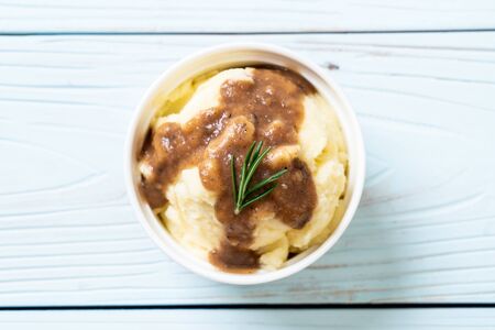 homemade mashed potatoes with gravy sauceの写真素材