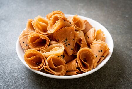 crispy coconut roll (Asian snack) on table