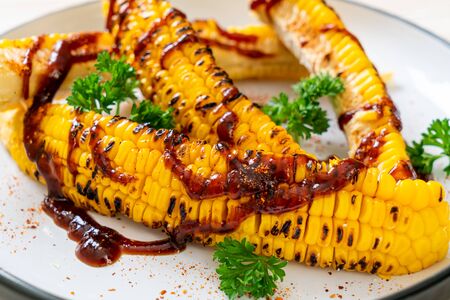 grilled and barbecue corn with bbq sauceの写真素材