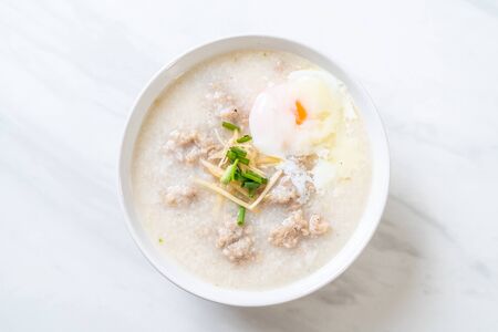 congee with minced pork in bowl - Asian breakfast styleの写真素材