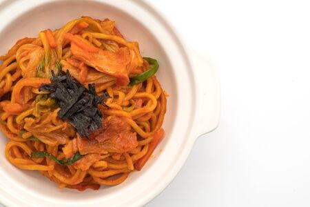 stir-fried noodles with Korean spicy sauce and vegetable isolated on white backgroundの写真素材