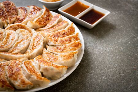 fried gyoza or dumplings snack with soy sauce in Japanese styleの写真素材