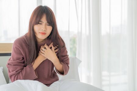 beautiful Asian women Heart disease on bed