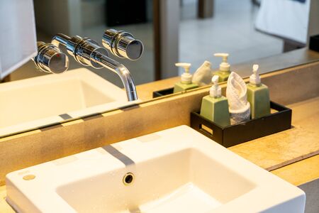 Tap with basin in bathroomの写真素材