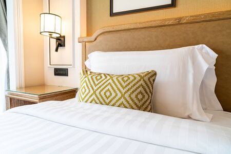 comfortable pillows decoration on bed in hotel bedroom