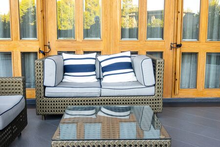 pillows with outdoor patio deck and sofa on balcony in gardenの写真素材